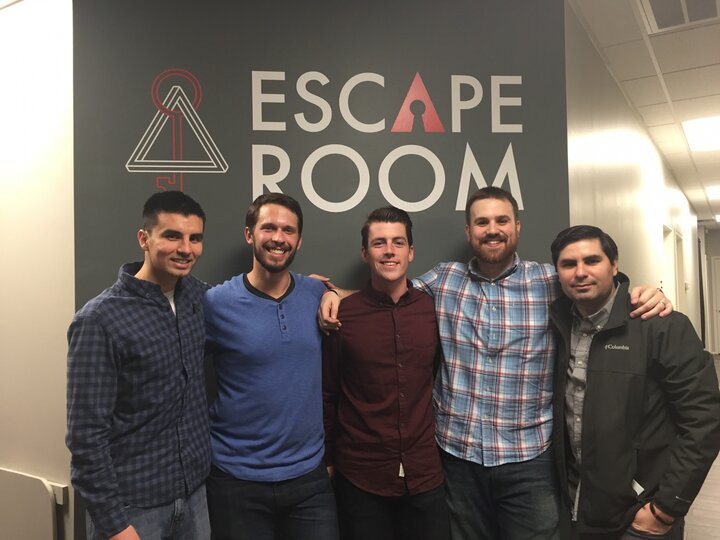 Lab Group Photo in front of escape room sign